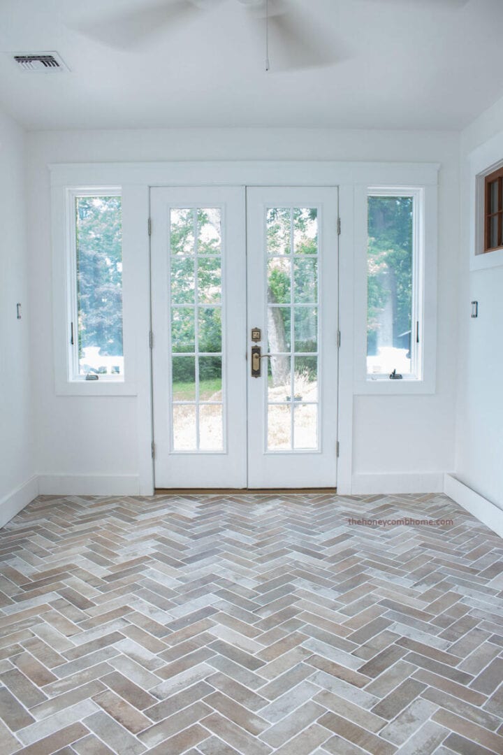 sunroom-with-brick-tiled-floors-the-honeycomb-home